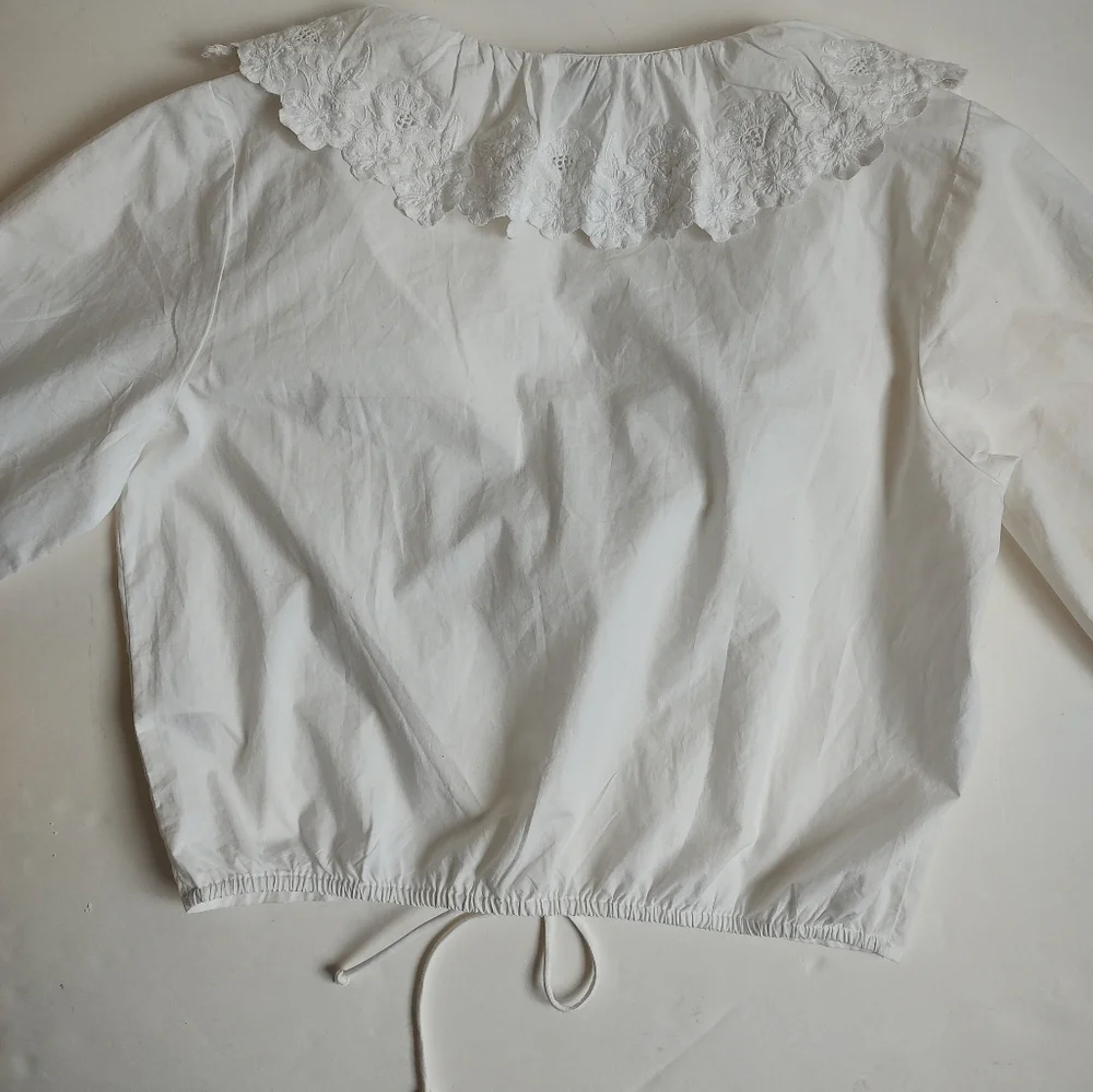 Maeve White Ruffled V-Neck Drawstring Blouse